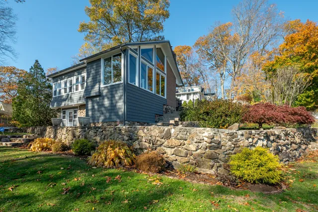 a front view of house with garden