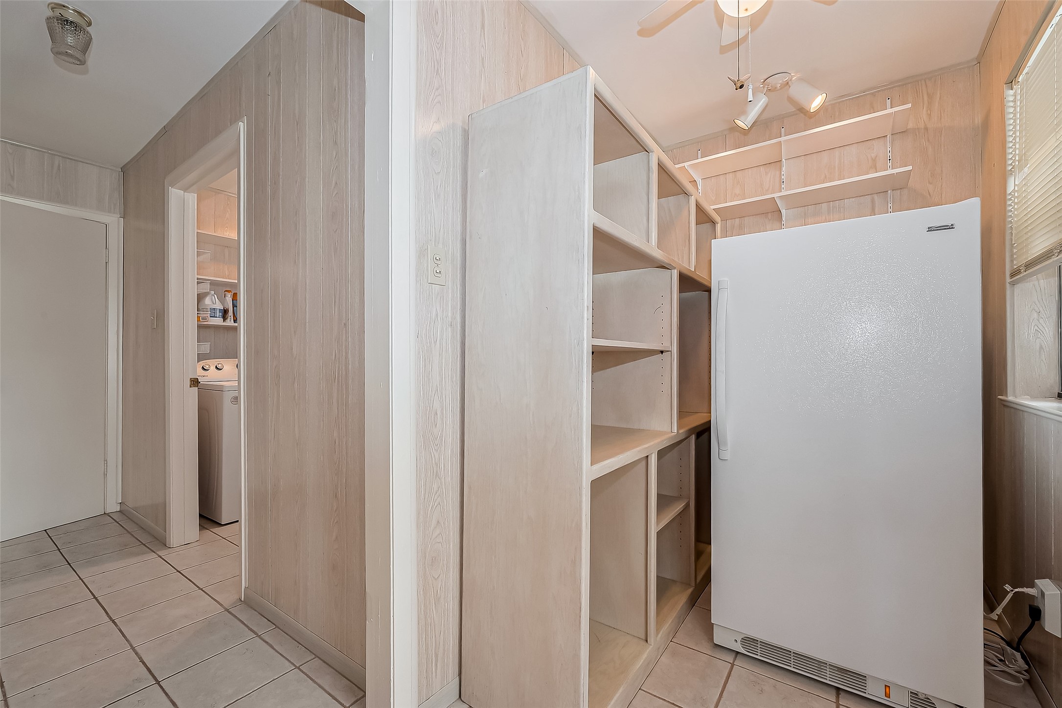 9214 Church Street Needville, TX 77461 - Photo 21 of 44 a view of walk in closet with empty racks