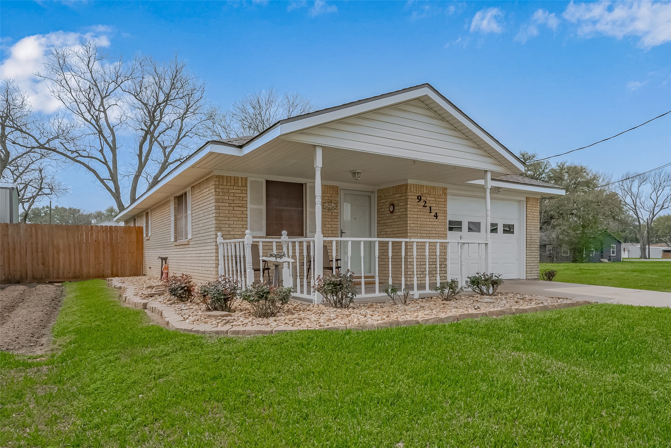 9214 Church Street Needville, TX 77461 - Photo 3 of 44 a front view of a house with garden