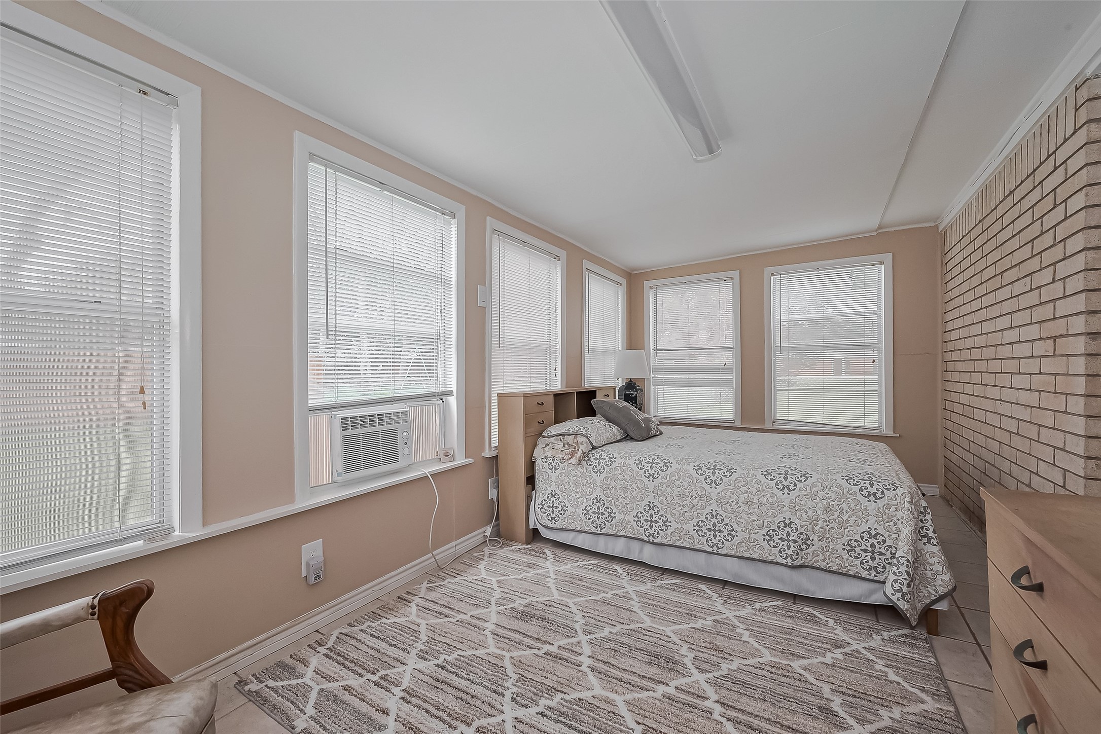 9214 Church Street Needville, TX 77461 - Photo 36 of 44 a bedroom with a large bed and a large window