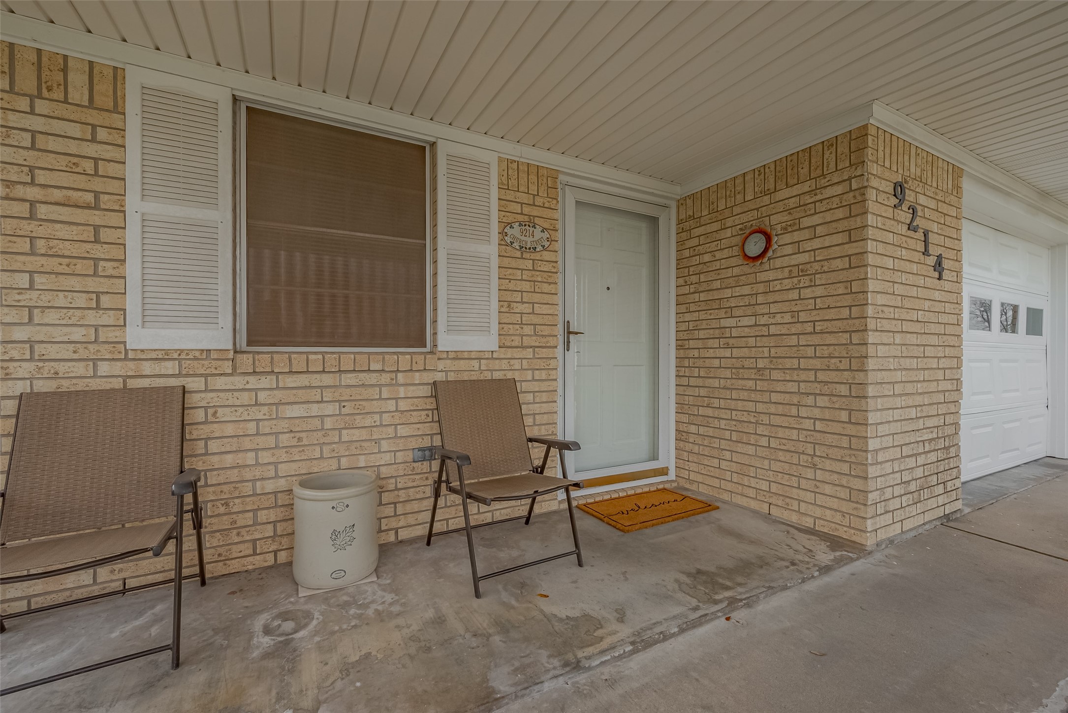 9214 Church Street Needville, TX 77461 - Photo 6 of 44 a brick house with table and chairs