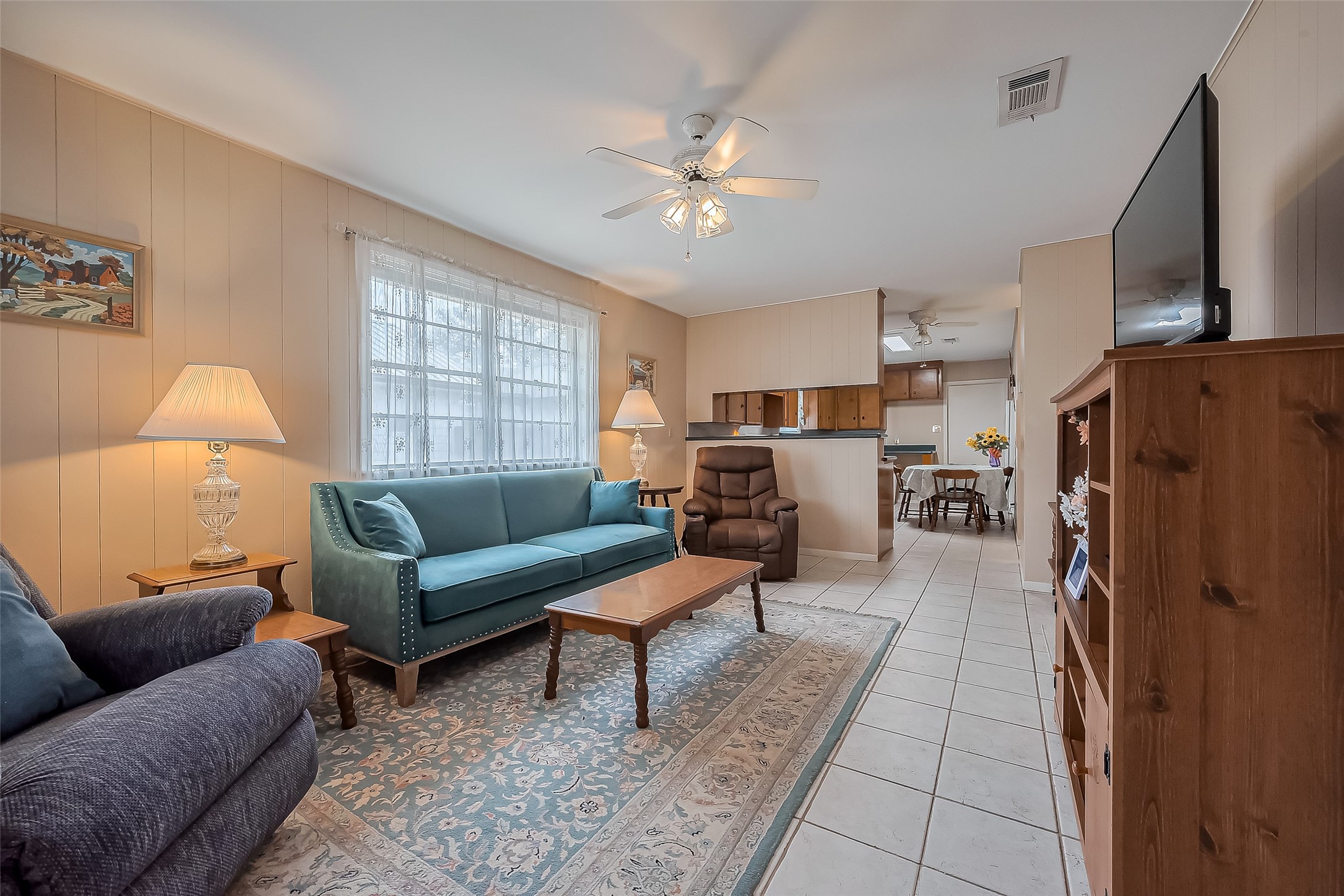 9214 Church Street Needville, TX 77461 - Photo 8 of 44 a living room with furniture and a chandelier
