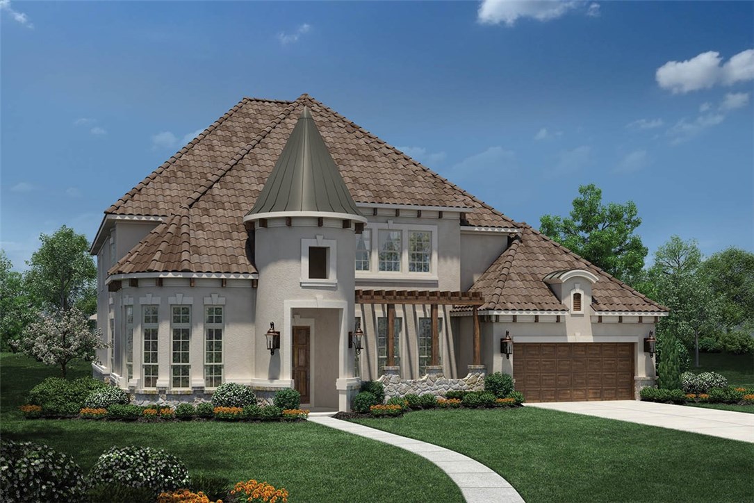 a front view of a house with a yard and trees