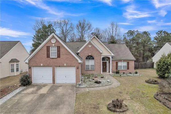 front view of a house with a yard