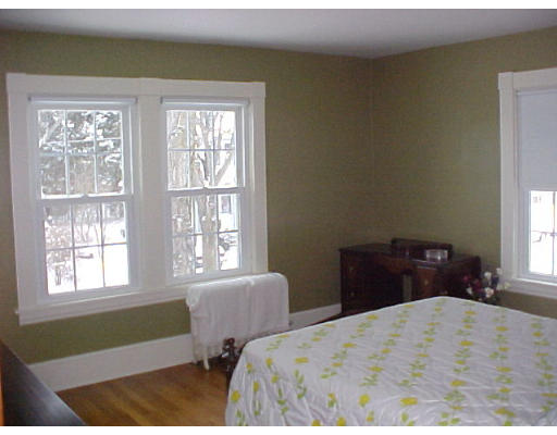 25 Winnipeg Street Springfield, MA 01108 - Photo 13 of 20 a bedroom with two beds and a window