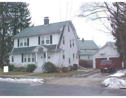25 Winnipeg Street Springfield, MA 01108 - Photo 2 of 20 a front view of a house with a yard and garage