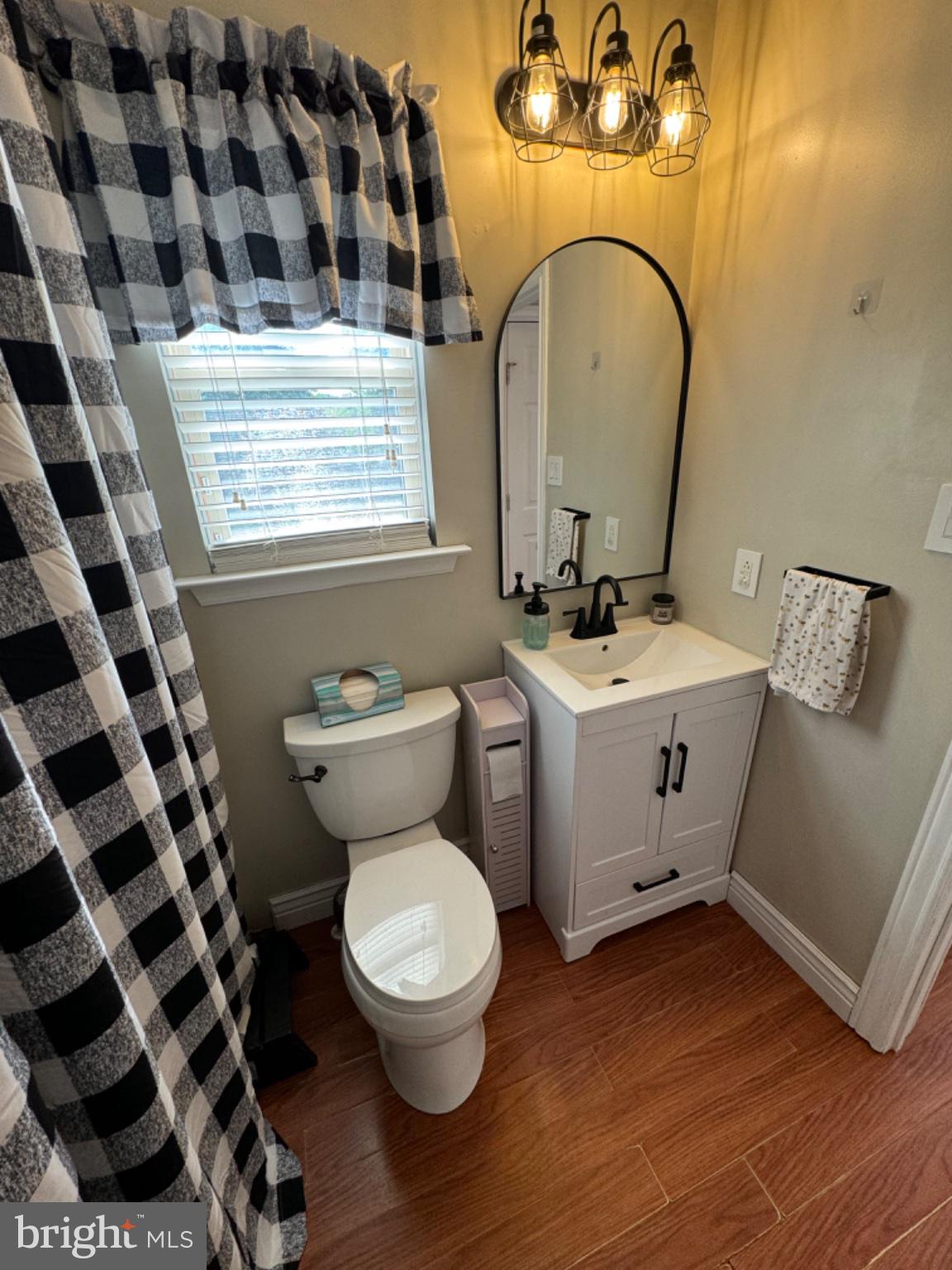 855 South Spring Road Vineland, NJ 08361 - Photo 17 of 46 a bathroom with a sink toilet and a mirror
