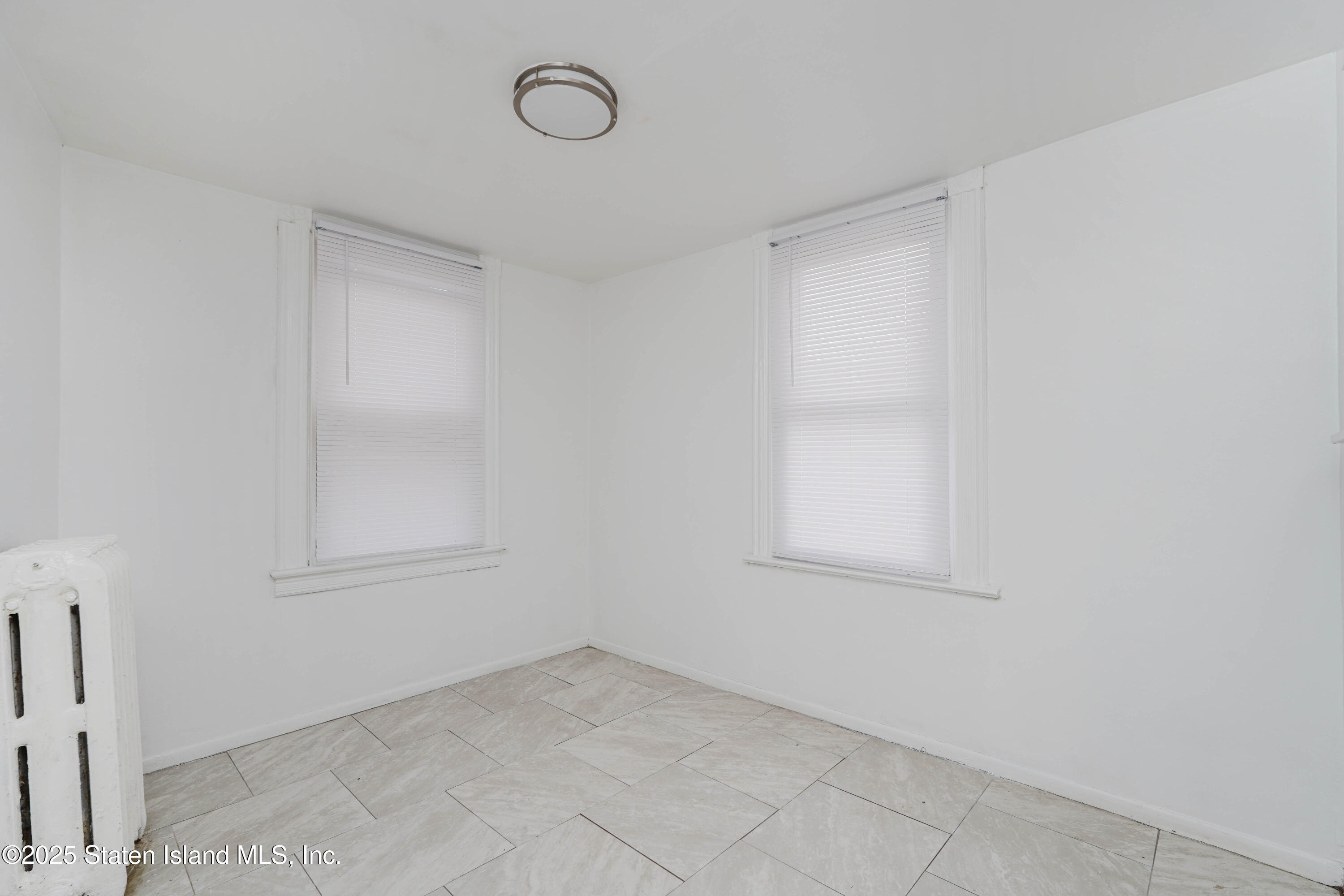 40 Larkin Street Staten Island, NY 10302 - Photo 16 of 36 an empty room with a window