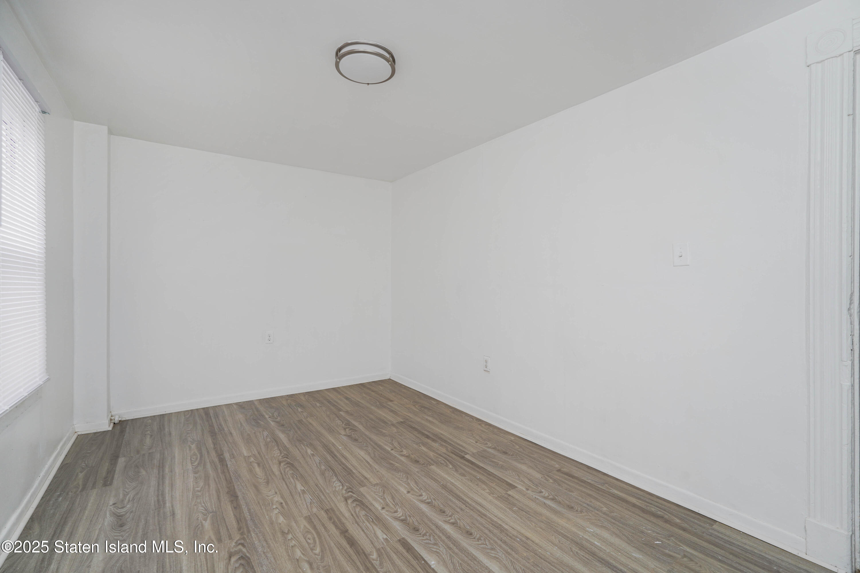 40 Larkin Street Staten Island, NY 10302 - Photo 23 of 36 a view of a room with wooden floor