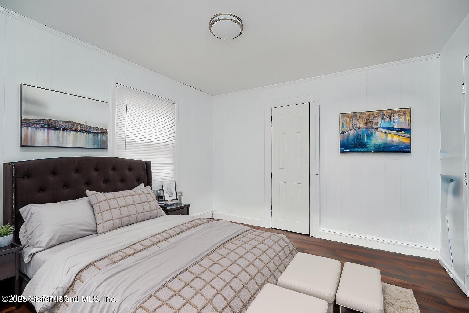 40 Larkin Street Staten Island, NY 10302 - Photo 26 of 36 a bedroom with a large bed and a window