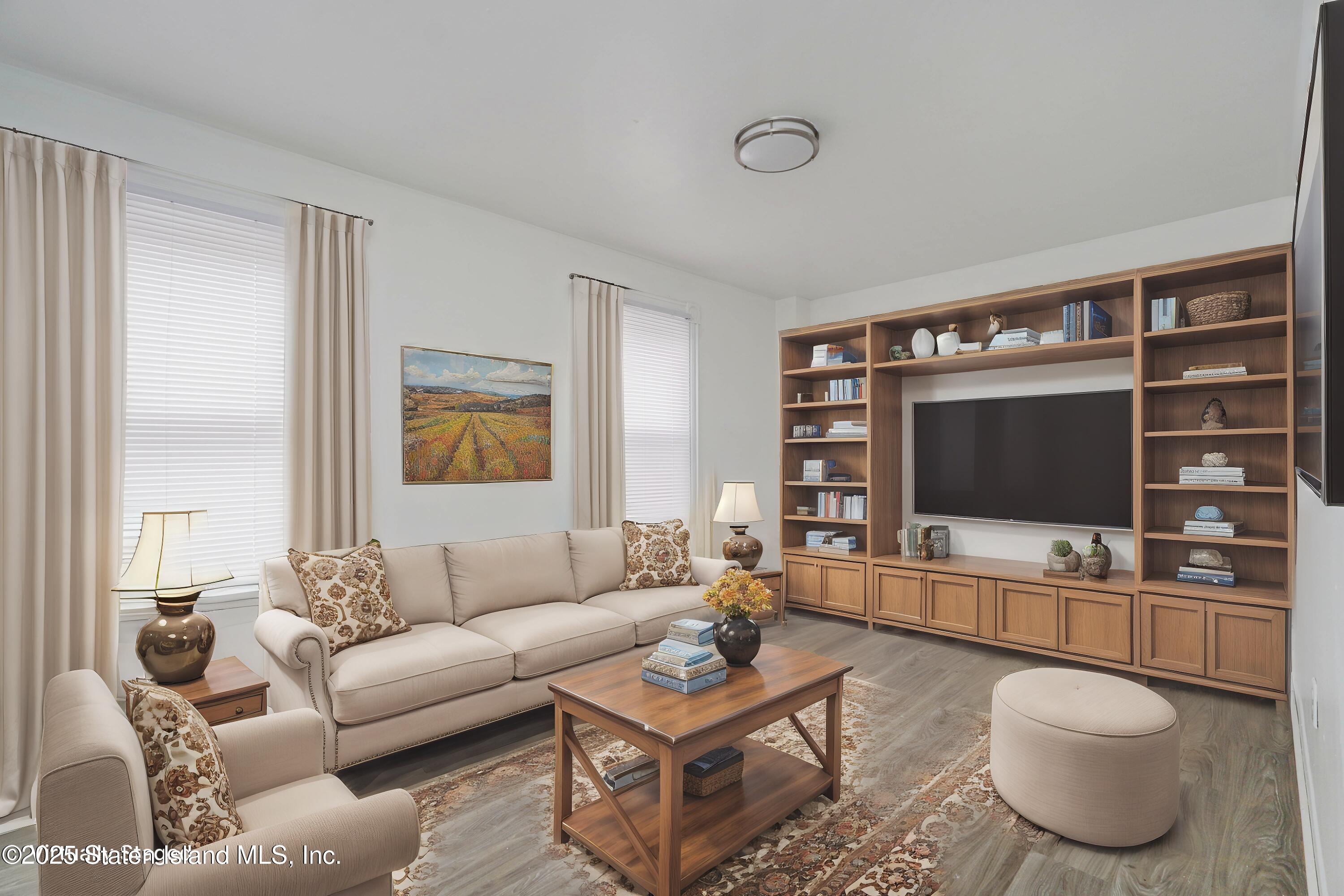 40 Larkin Street Staten Island, NY 10302 - Photo 28 of 36 a living room with furniture and a flat screen tv