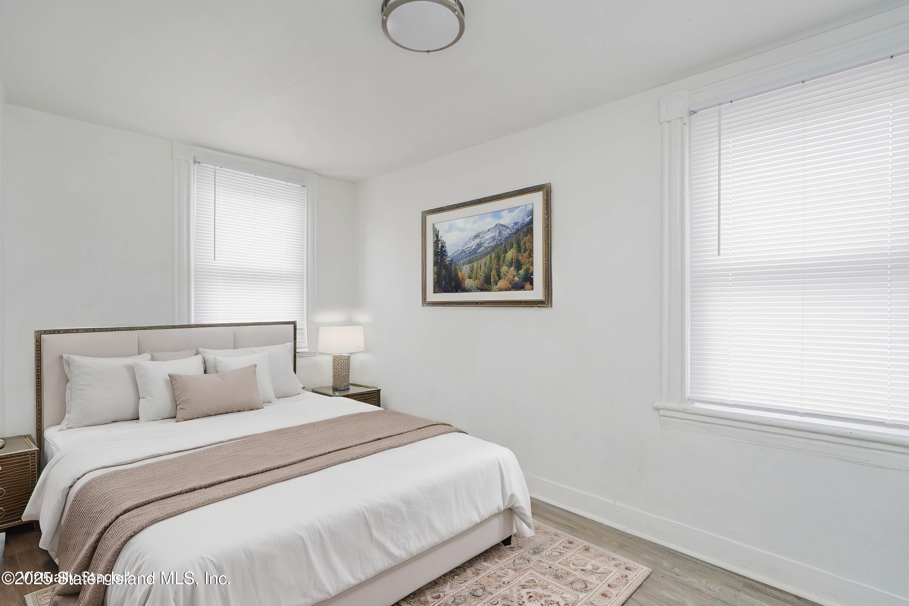 40 Larkin Street Staten Island, NY 10302 - Photo 29 of 36 a bedroom with a bed and a window