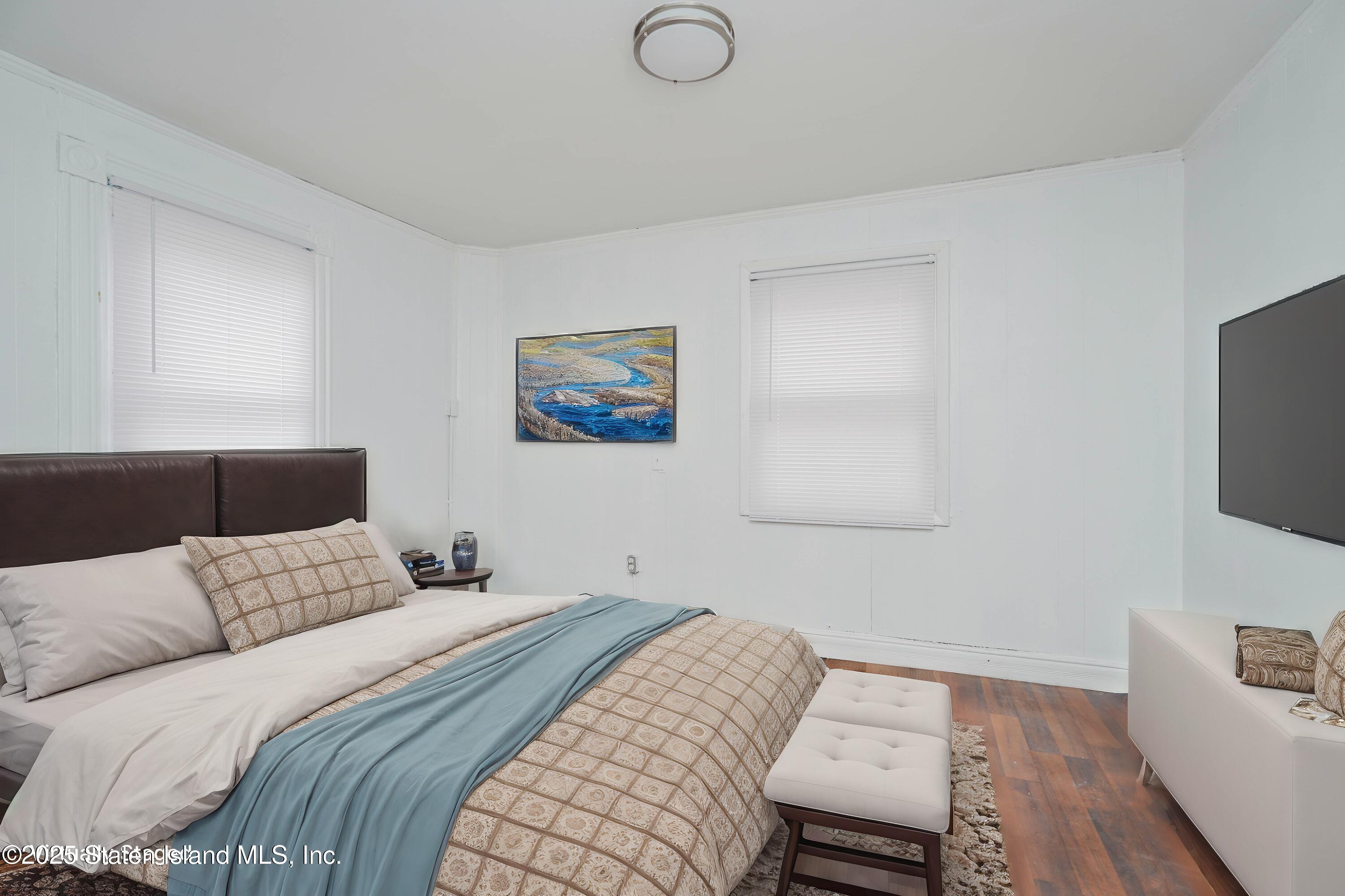 40 Larkin Street Staten Island, NY 10302 - Photo 30 of 36 a bedroom with a bed and a flat screen tv