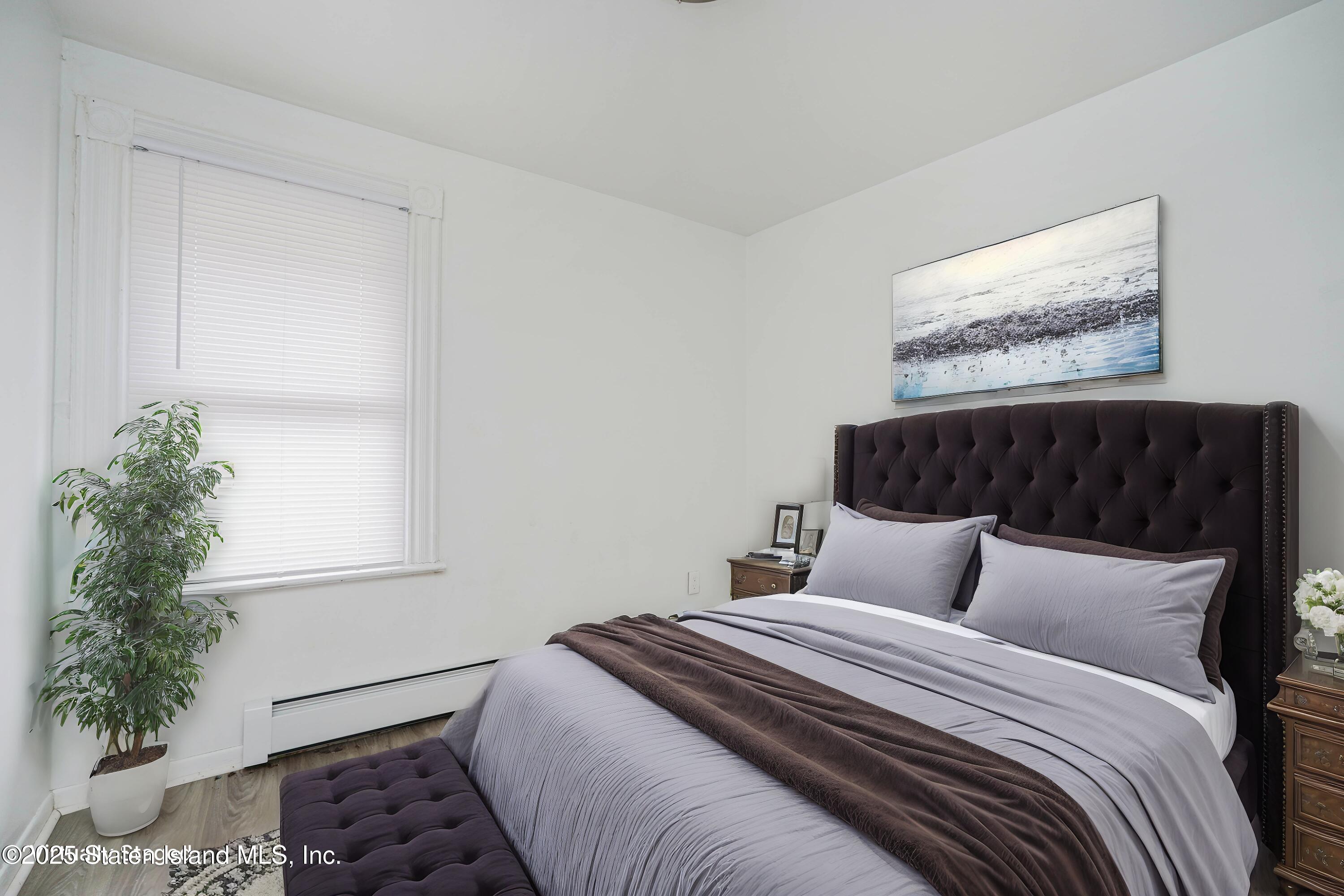 40 Larkin Street Staten Island, NY 10302 - Photo 31 of 36 a bedroom with bed and window