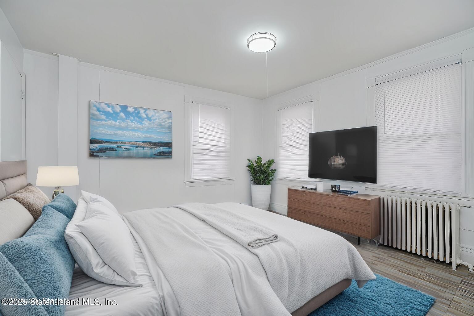 40 Larkin Street Staten Island, NY 10302 - Photo 36 of 36 a bedroom with a bed and a flat screen tv
