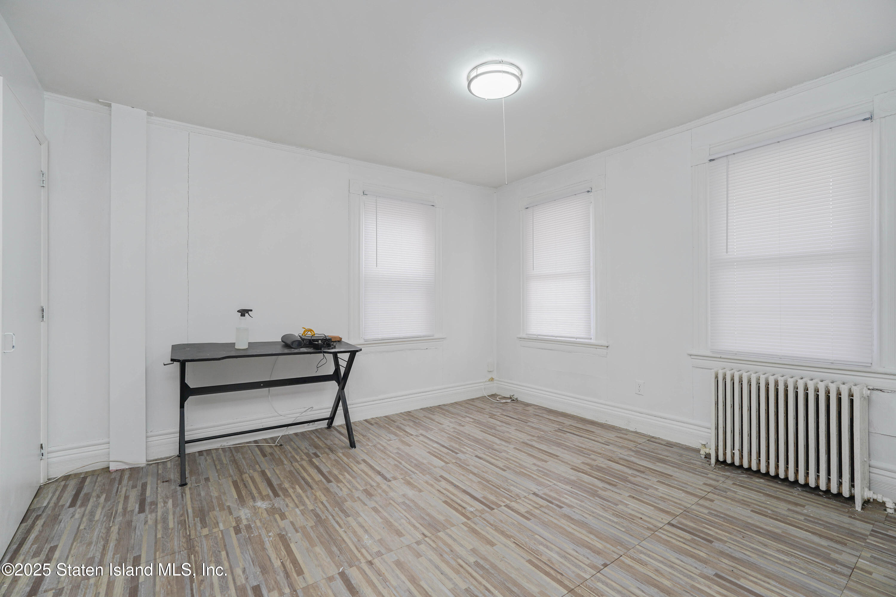 40 Larkin Street Staten Island, NY 10302 - Photo 6 of 36 a view of a room with wooden floor and bench