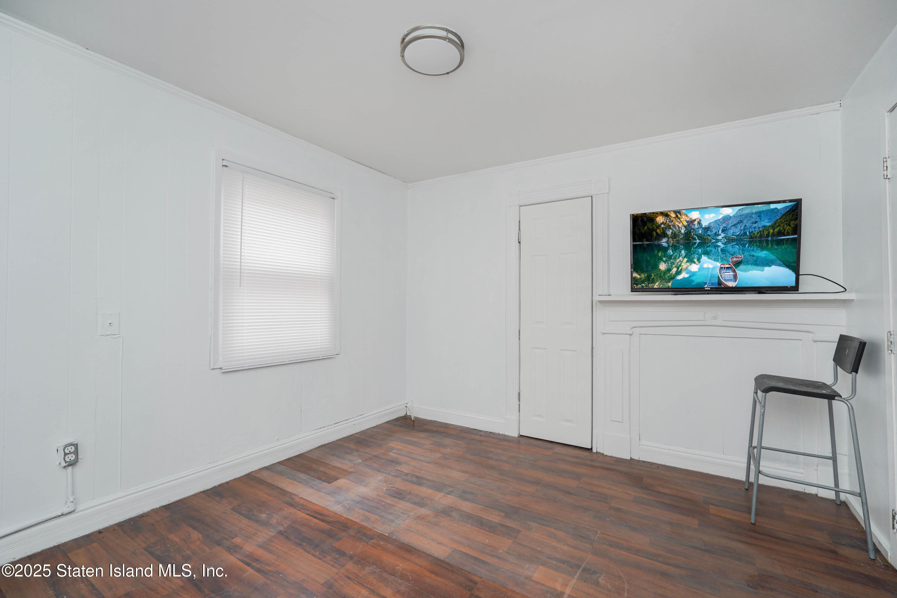 40 Larkin Street Staten Island, NY 10302 - Photo 9 of 36 wooden floor in an empty room with a window