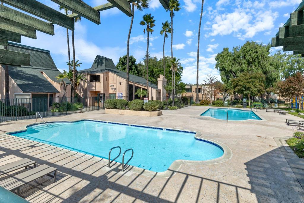 8717 Navajo Road, Unit 1 San Diego, CA 92119 - Photo 19 of 25 a view of outdoor space and swimming pool