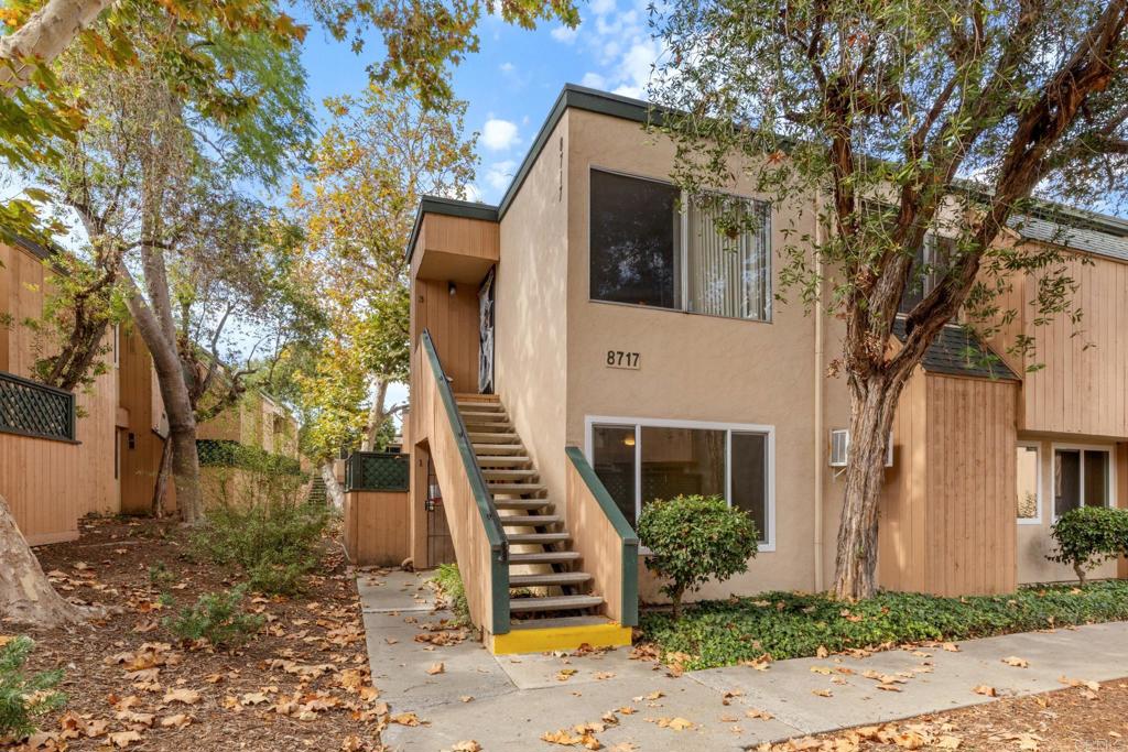 8717 Navajo Road, Unit 1 San Diego, CA 92119 - Photo 3 of 25 a view of a white house with a large tree