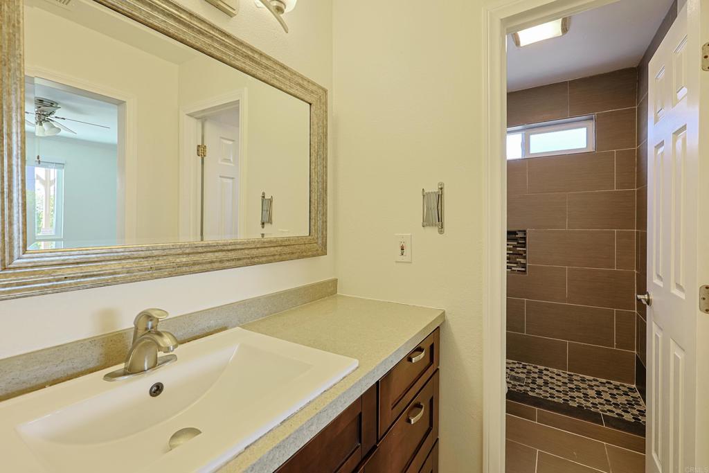 488 D Street Chula Vista, CA 91910 - Photo 13 of 25 a bathroom with a sink and a mirror