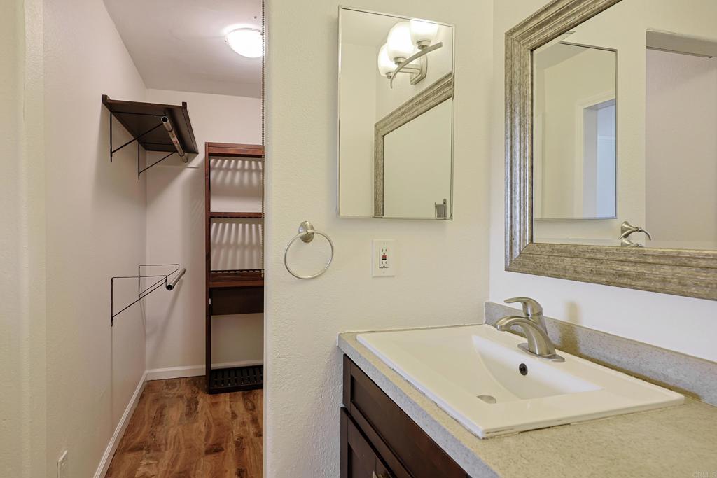 488 D Street Chula Vista, CA 91910 - Photo 14 of 25 a bathroom with a sink and a mirror