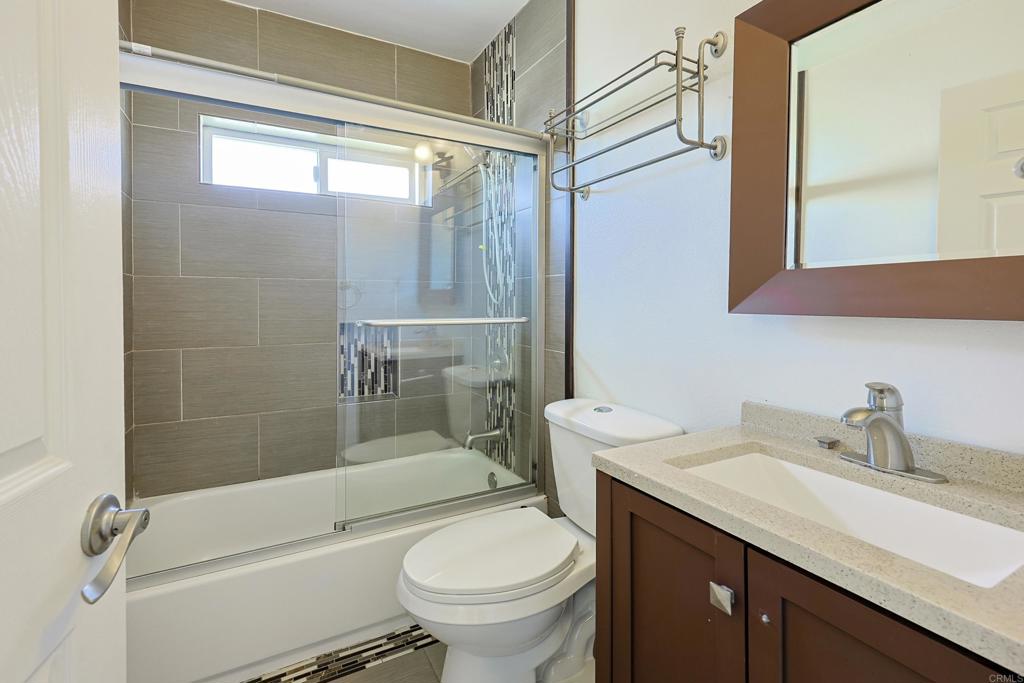 488 D Street Chula Vista, CA 91910 - Photo 19 of 25 a bathroom with a sink a toilet and shower