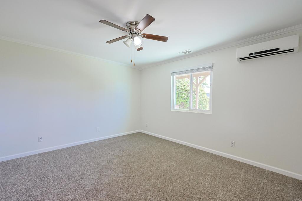 488 D Street Chula Vista, CA 91910 - Photo 10 of 25 an empty room with a window and a fan