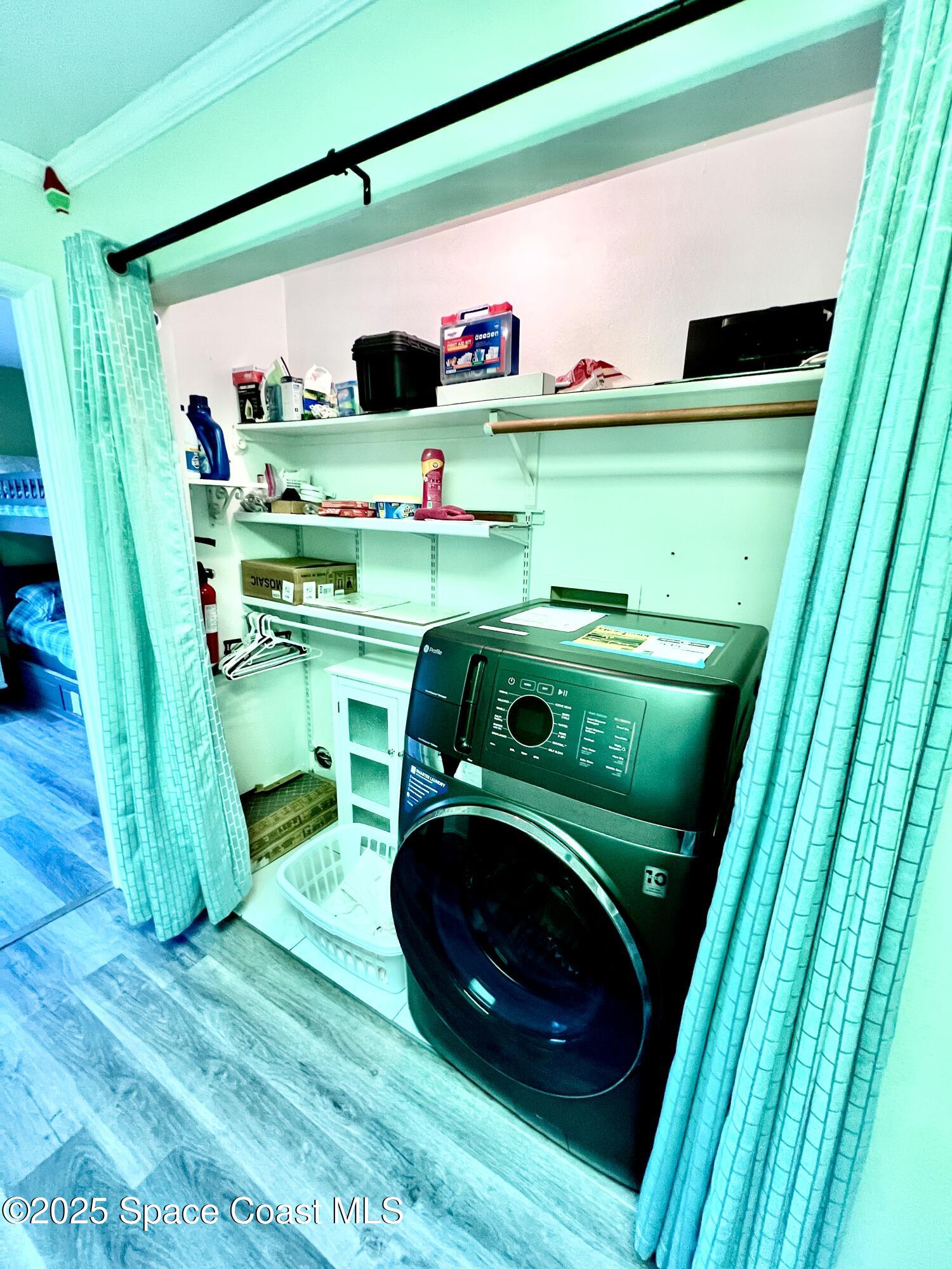 299 Chandler Street, Unit F Cape Canaveral, FL 32920 - Photo 15 of 26 a utility room with dryer and washer