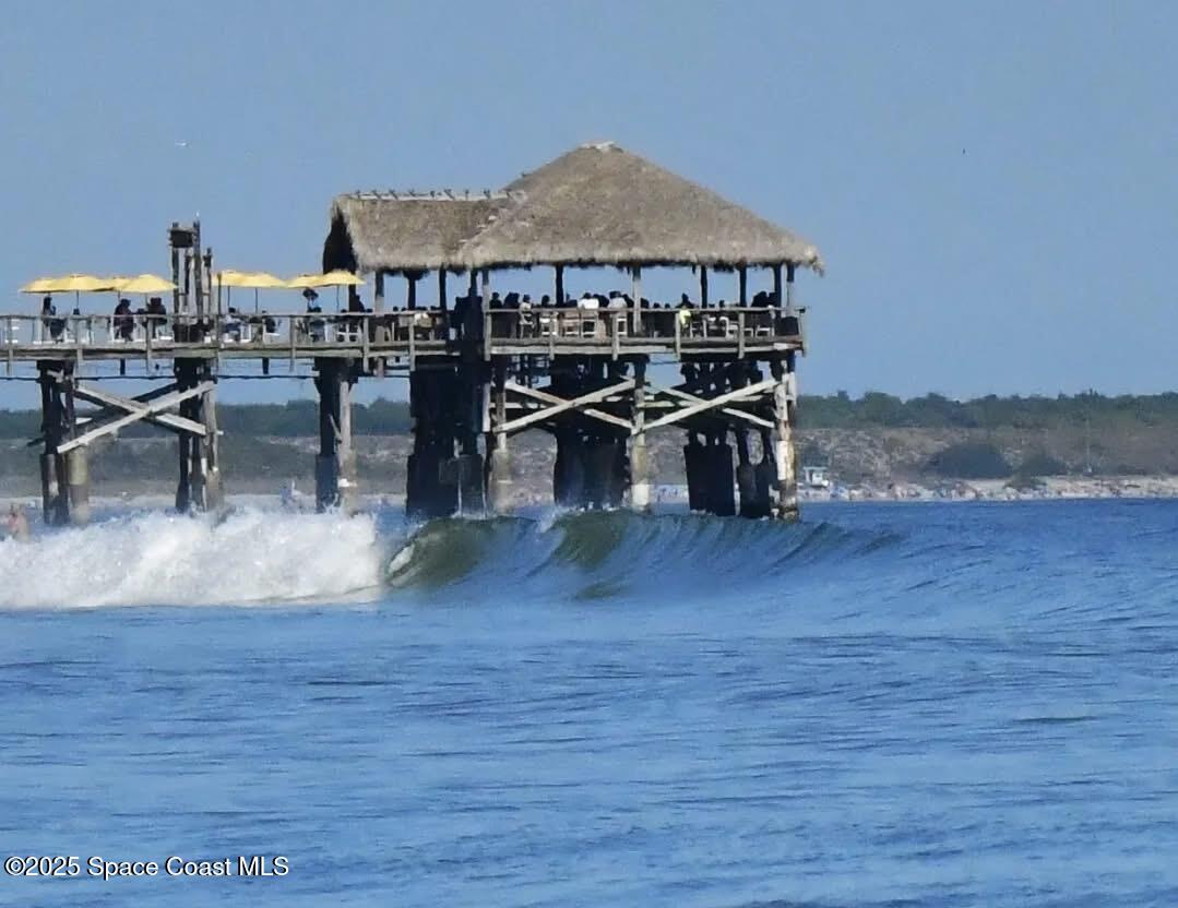 299 Chandler Street, Unit F Cape Canaveral, FL 32920 - Photo 17 of 26 a view of a house with balcony