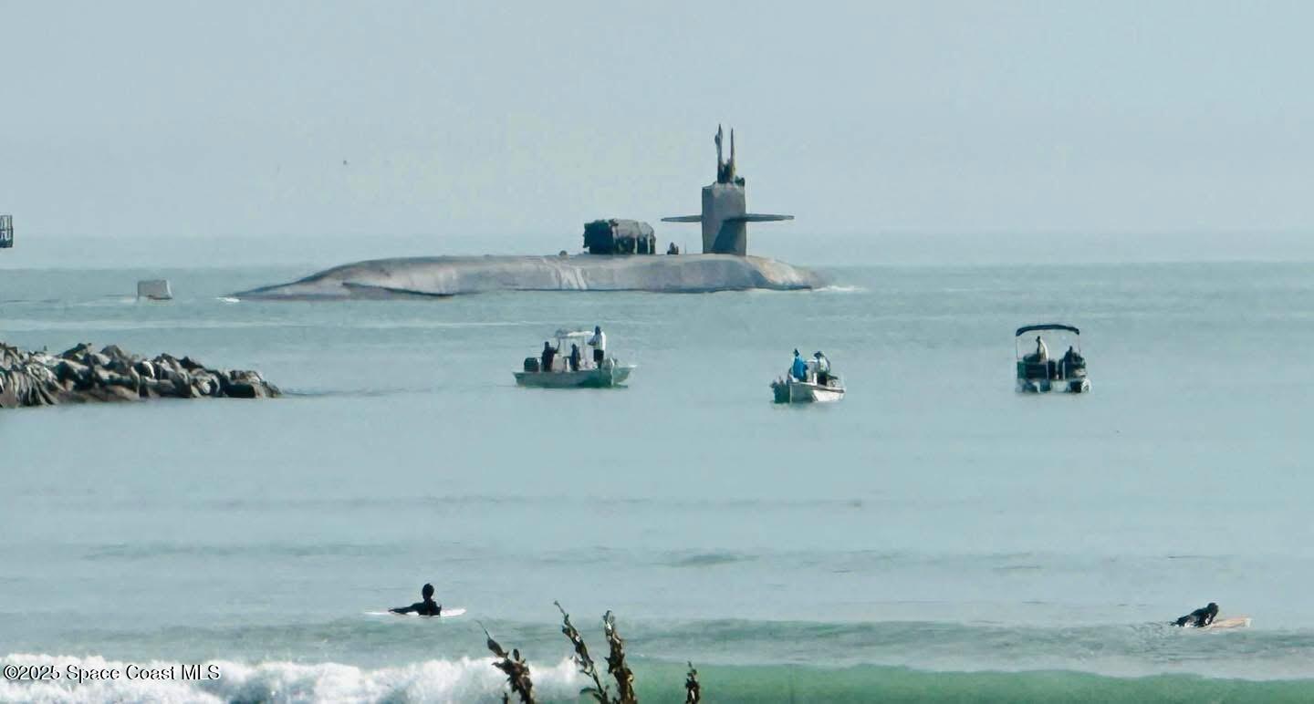 299 Chandler Street, Unit F Cape Canaveral, FL 32920 - Photo 24 of 26 a bathroom with a bathtub