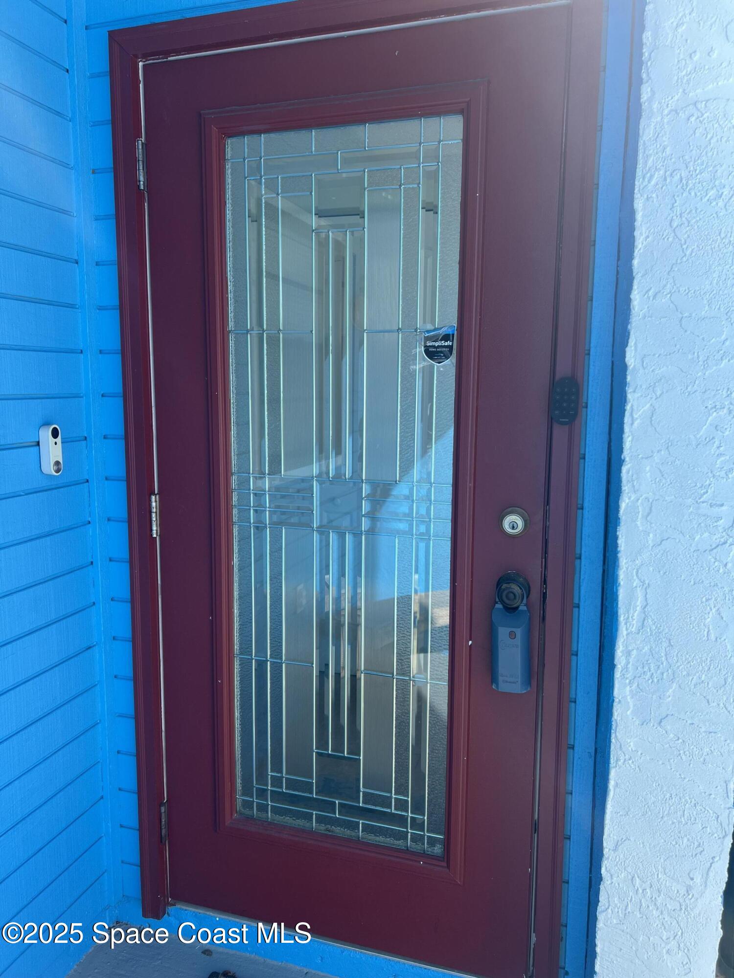 299 Chandler Street, Unit F Cape Canaveral, FL 32920 - Photo 25 of 26 a view of a red door in the house