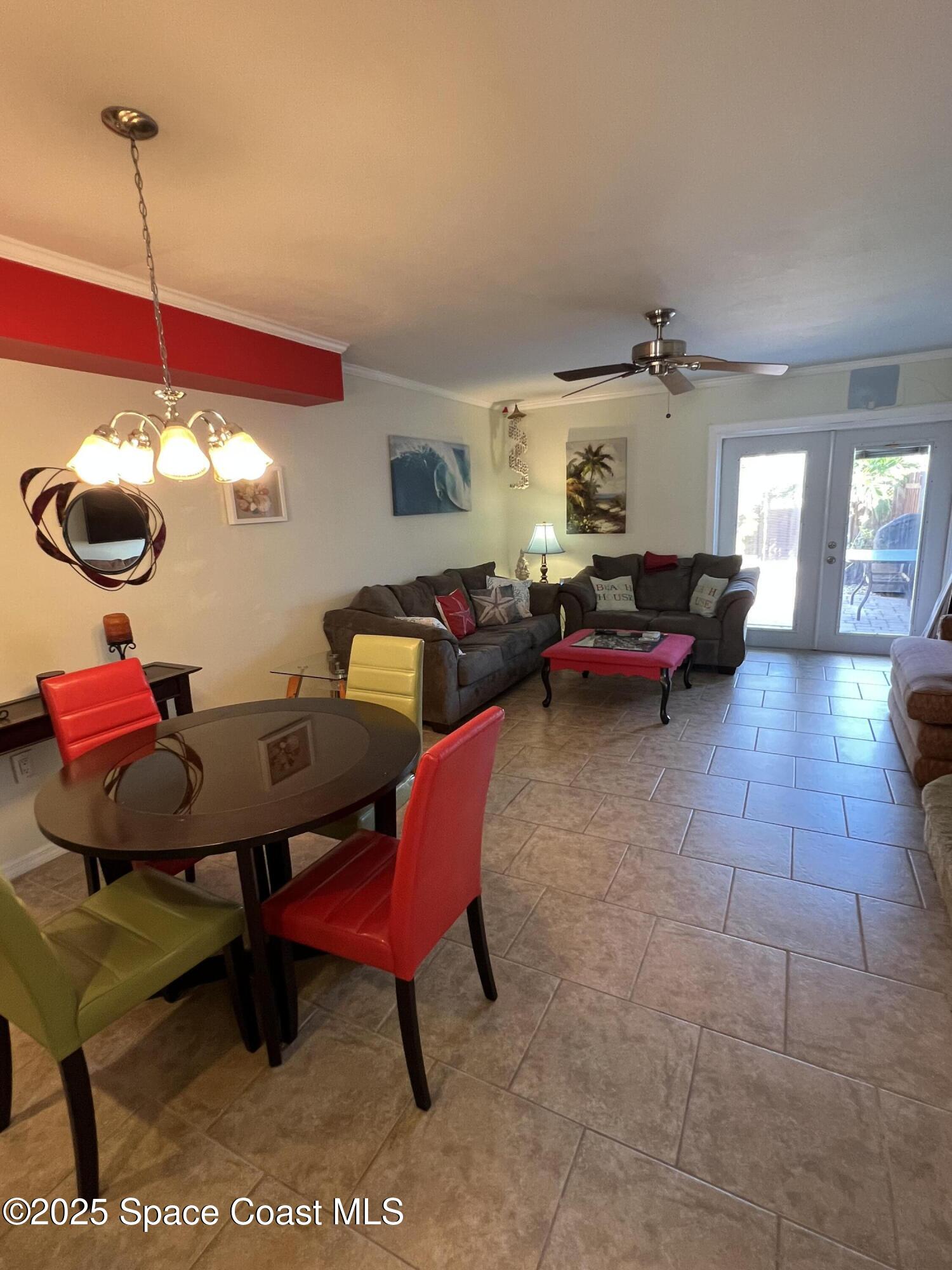 299 Chandler Street, Unit F Cape Canaveral, FL 32920 - Photo 7 of 26 a living room with furniture and rug