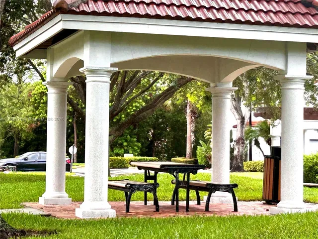 an aerial view of a house with a yard and garden