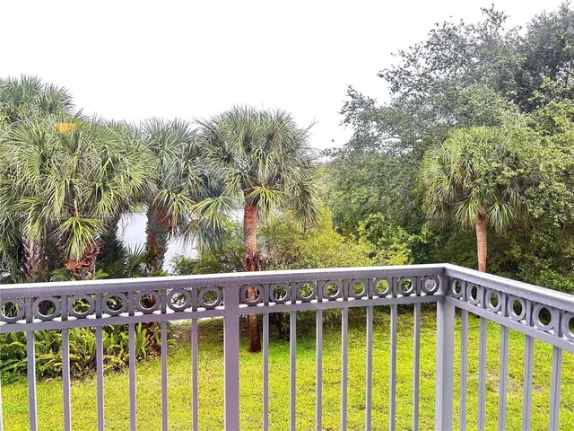 a view of a small yard with wooden fence
