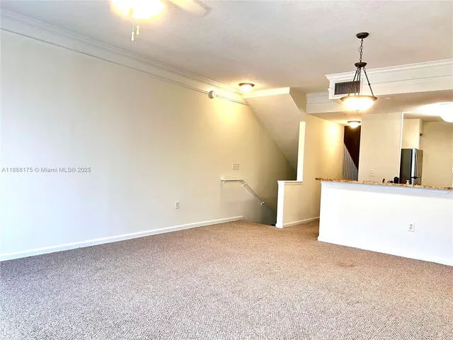 a view of a room with a sink and a mirror