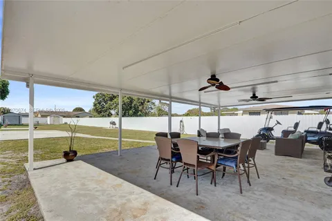 a view of a swimming pool with an outdoor seating