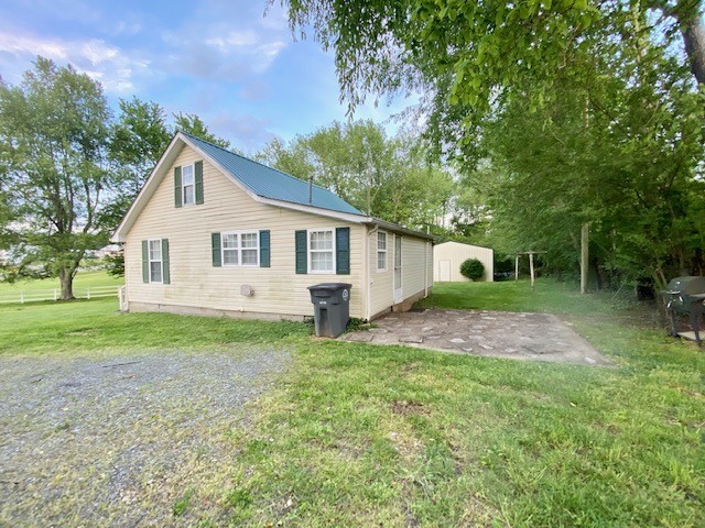 610 Days Road Lafayette, TN 37083 - Photo 3 of 13 a view of a house with backyard and garden