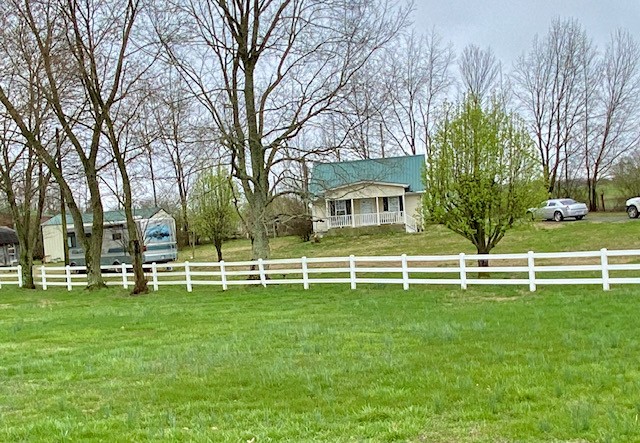 610 Days Road Lafayette, TN 37083 - Photo 4 of 13 a white house with a big yard and trees