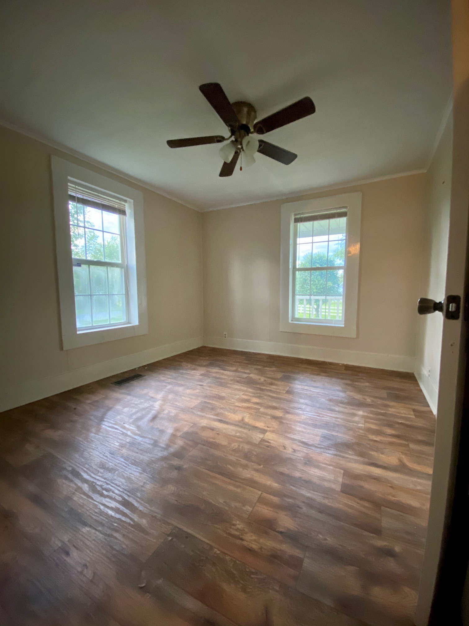 610 Days Road Lafayette, TN 37083 - Photo 9 of 13 wooden floor in an empty room with a window