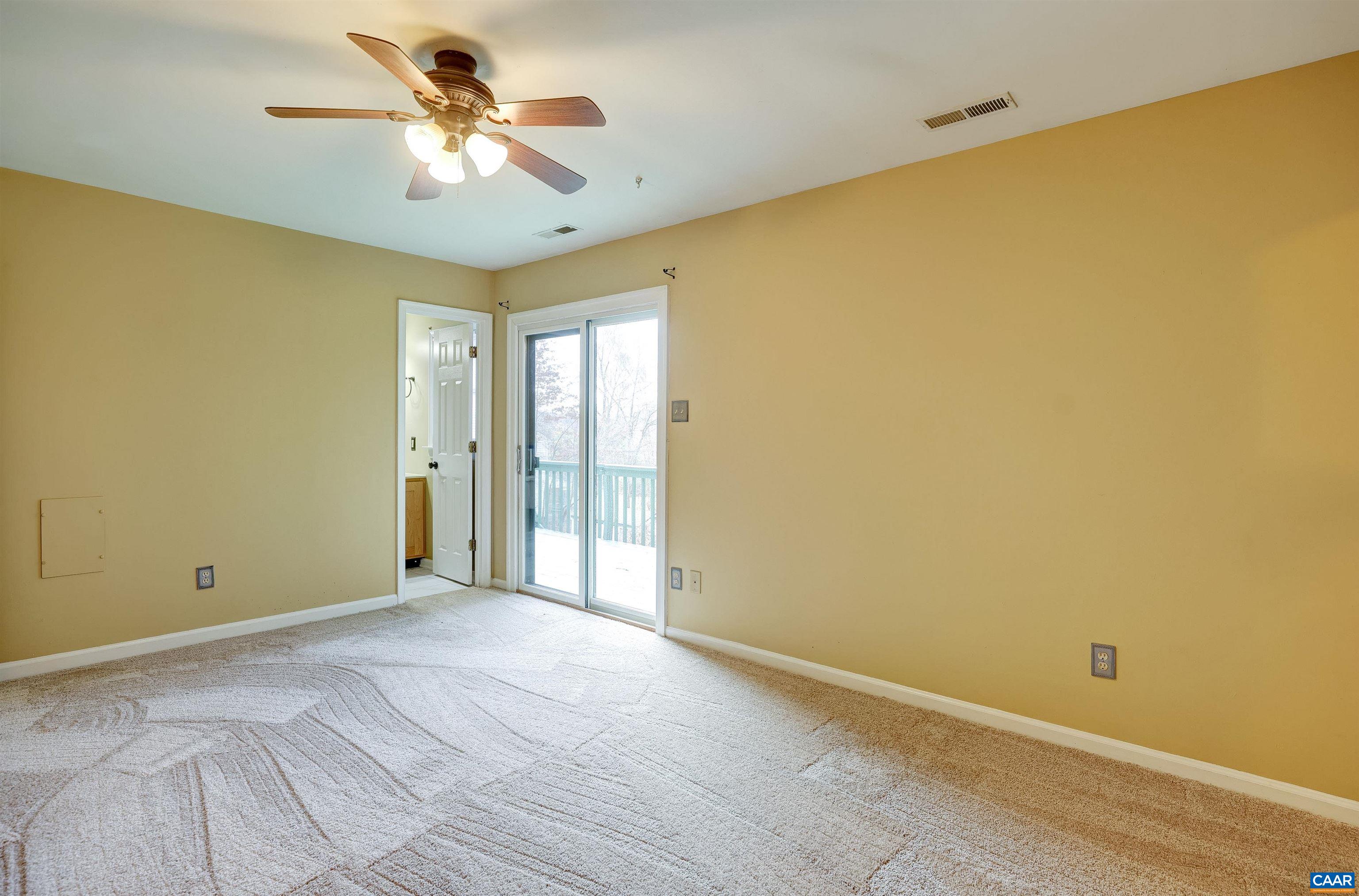 1086 West Daffodil Road Ruckersville, VA 22968 - Photo 14 of 33 a view of a big room with windows and chandelier fan