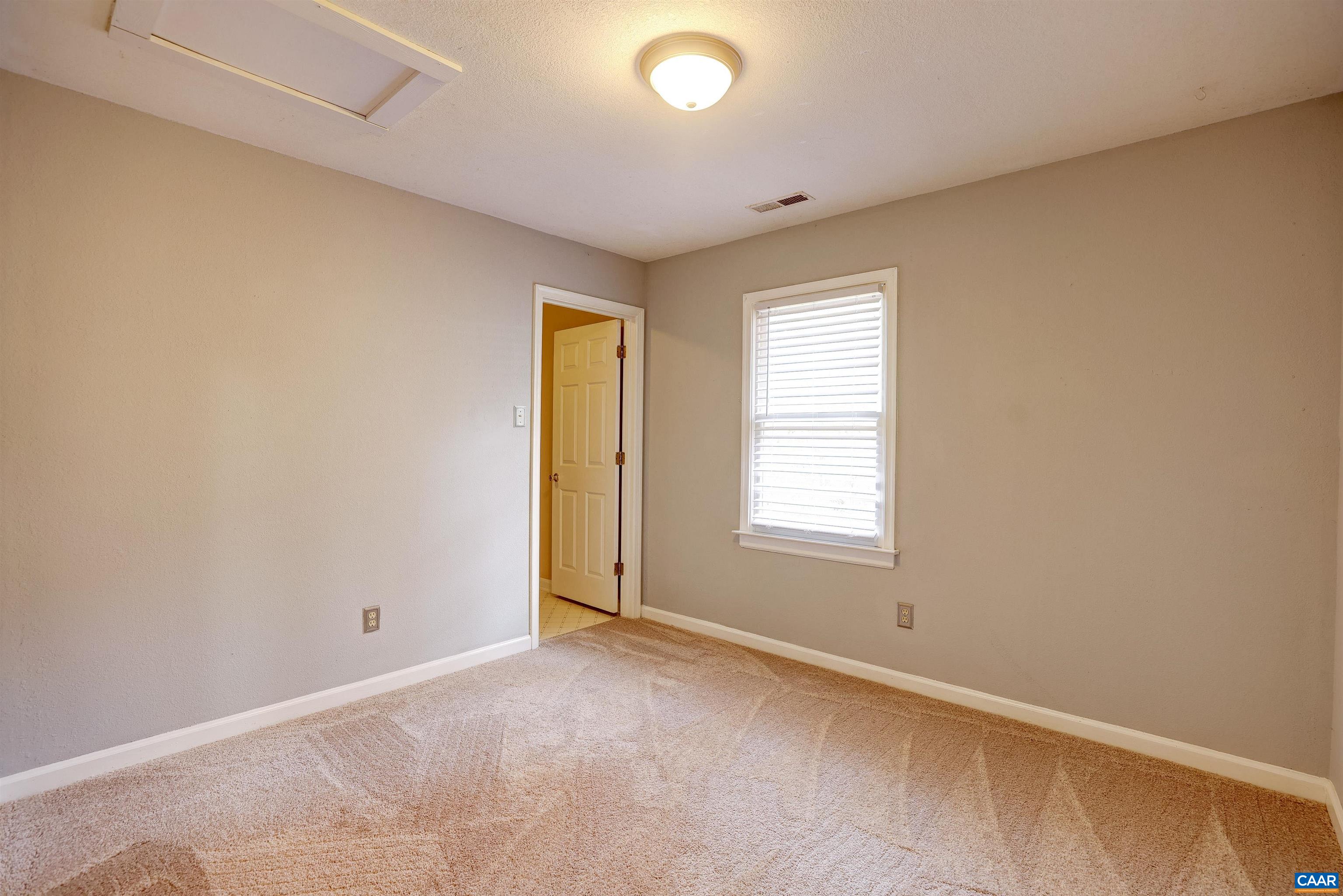 1086 West Daffodil Road Ruckersville, VA 22968 - Photo 18 of 33 a view of an empty room with a window