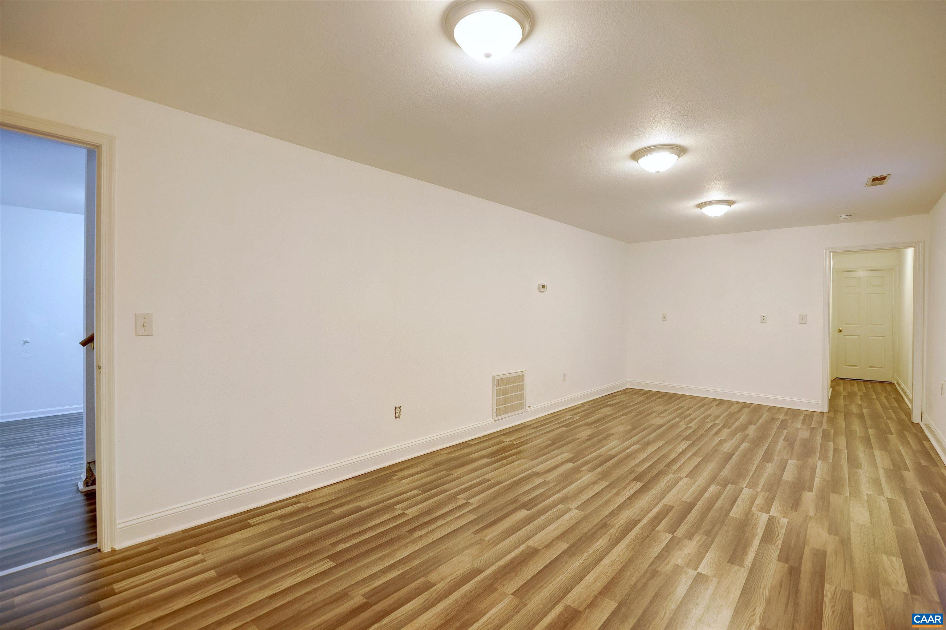 1086 West Daffodil Road Ruckersville, VA 22968 - Photo 20 of 33 a view of empty room with wooden floor
