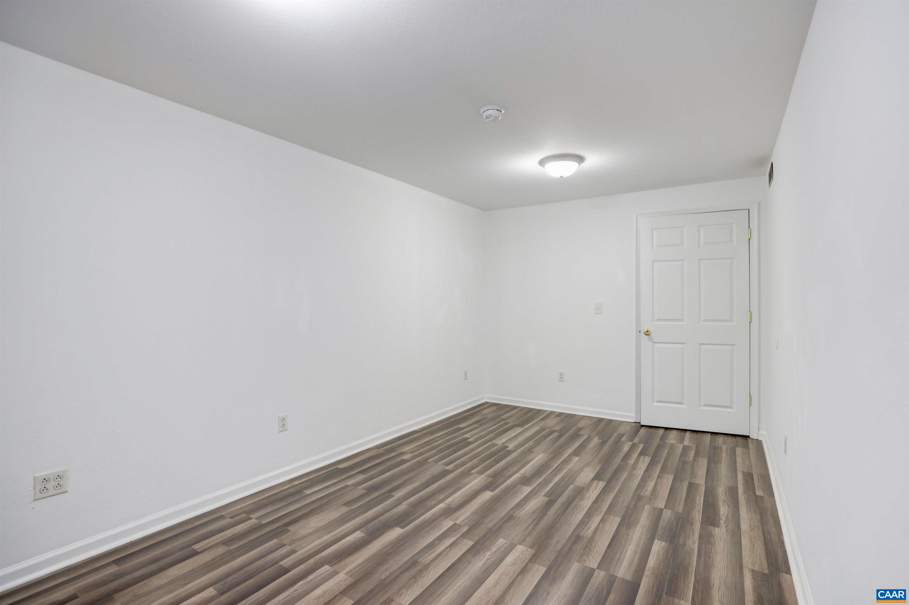 1086 West Daffodil Road Ruckersville, VA 22968 - Photo 22 of 33 a view of room with wooden floor