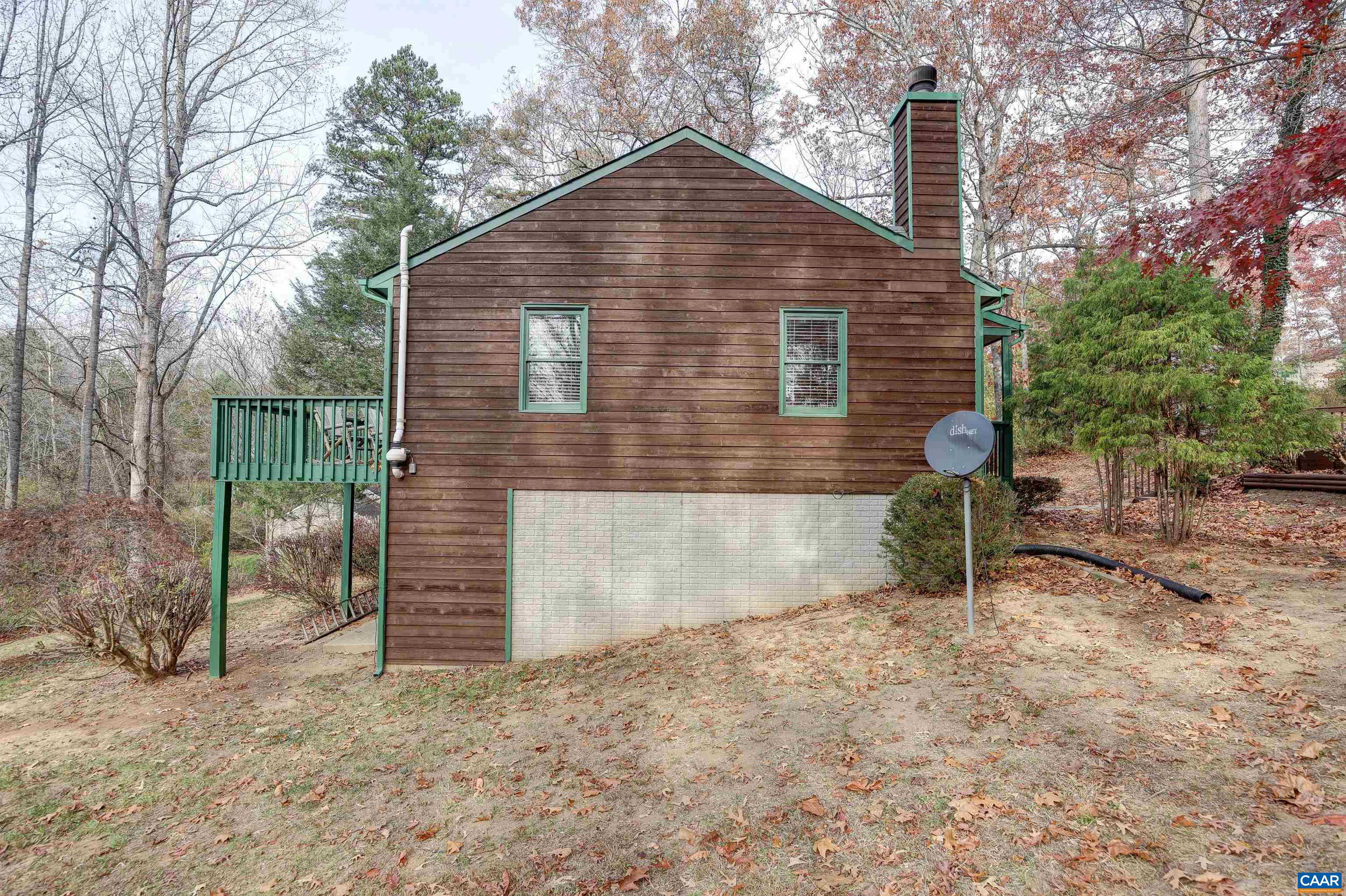 1086 West Daffodil Road Ruckersville, VA 22968 - Photo 29 of 33 a brick house with tree in front of it