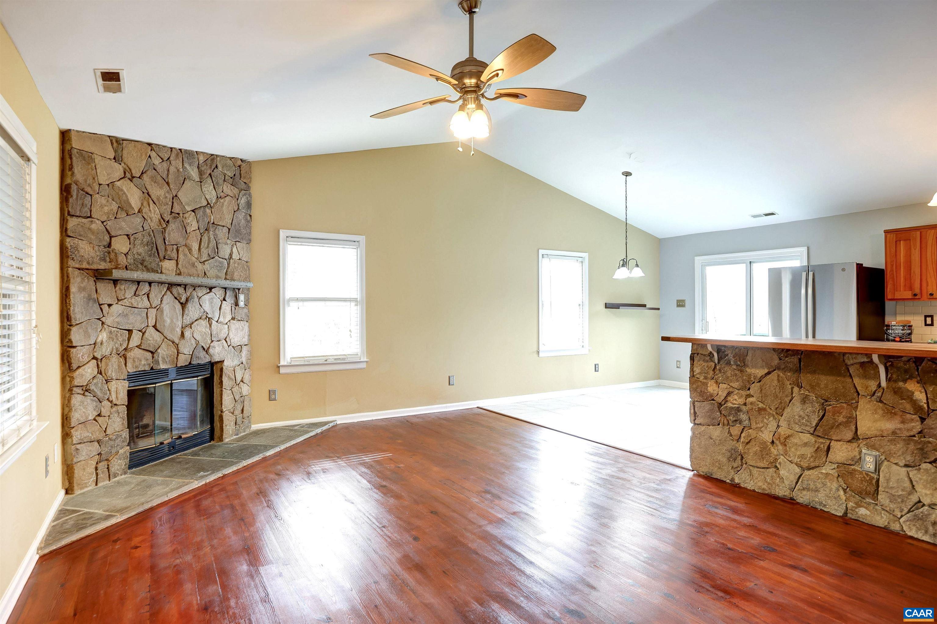 1086 West Daffodil Road Ruckersville, VA 22968 - Photo 3 of 33 a view of an empty room with window and wooden floor