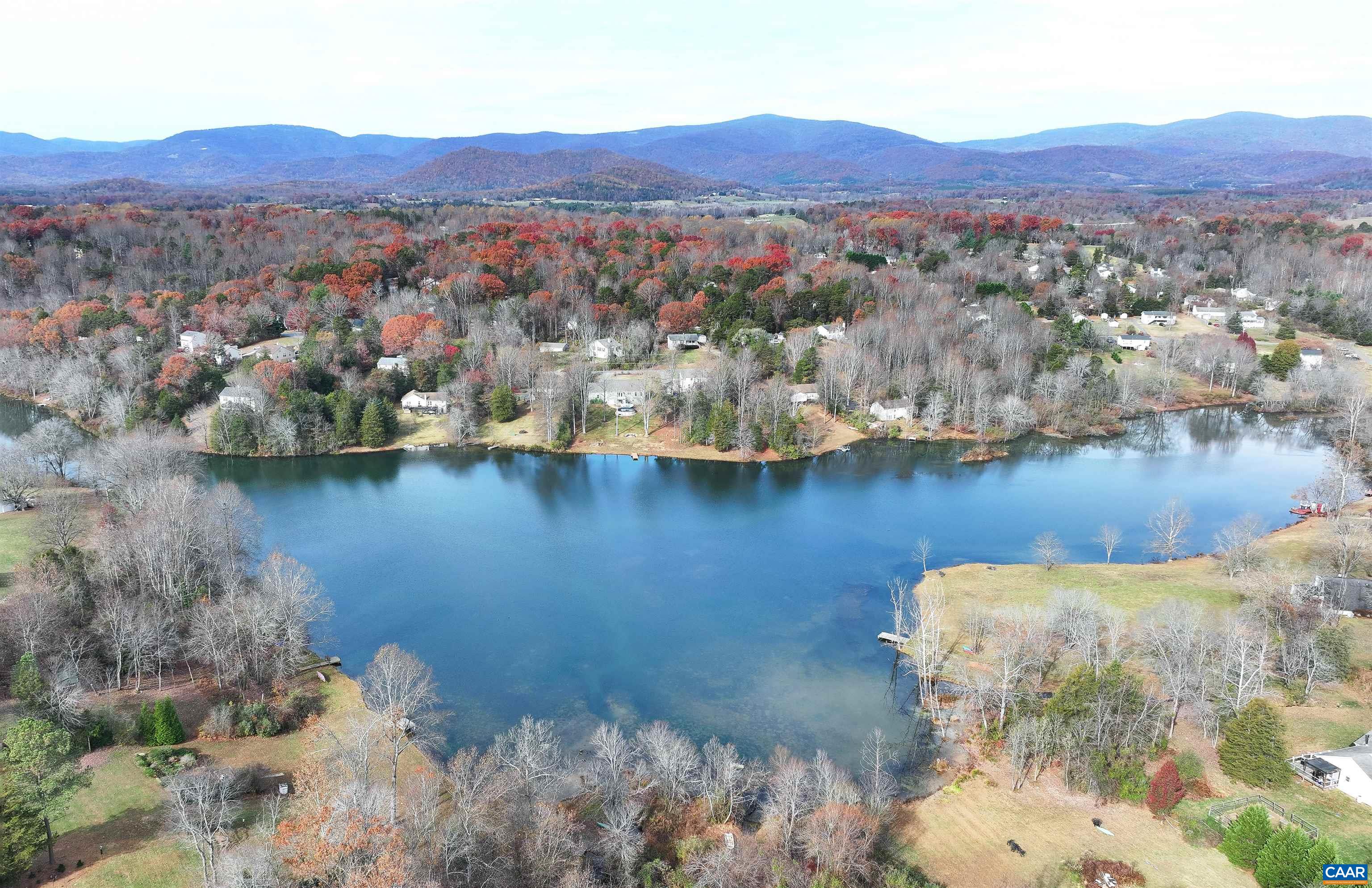 1086 West Daffodil Road Ruckersville, VA 22968 - Photo 32 of 33 a view of a lake with mountains in the background
