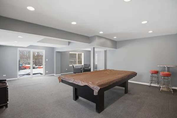a room with furniture and pool table
