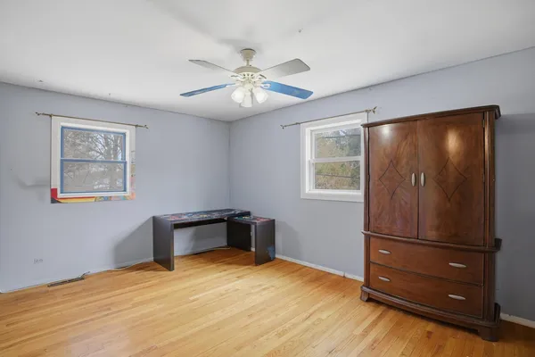 a view of room with window and cabinet