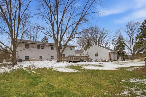 a house with a large tree in front of it
