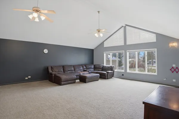 a living room with furniture and windows